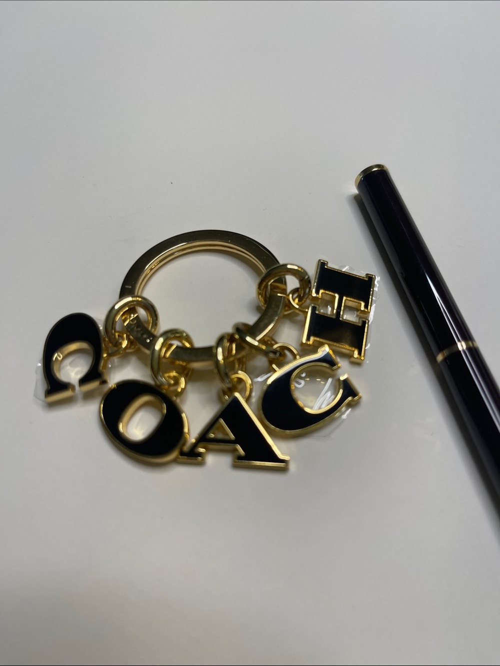 (2) COACH Black and Gold Charm Keyring and (2) hot pink Coach Pens - Picture 2 of 8